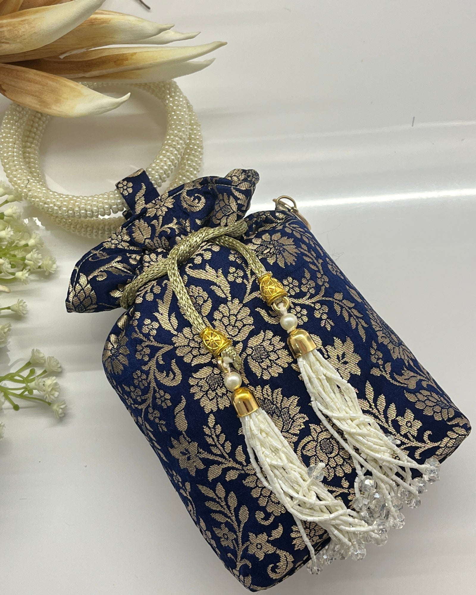 Blue Silk Banarsi Potli With Golden Floral Print