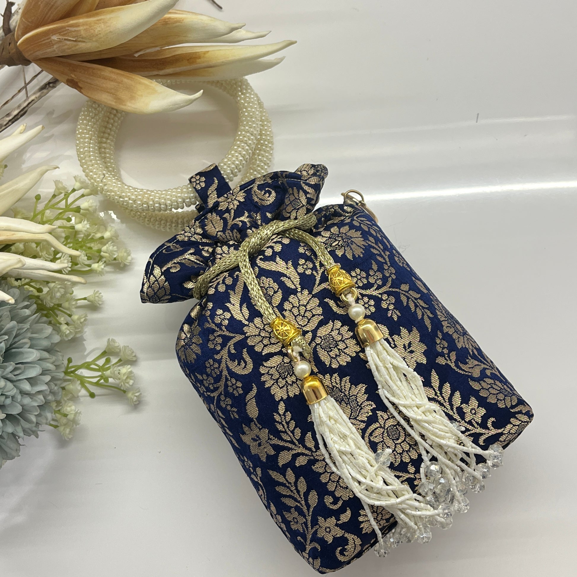 Blue Silk Banarsi Potli With Golden Floral Print