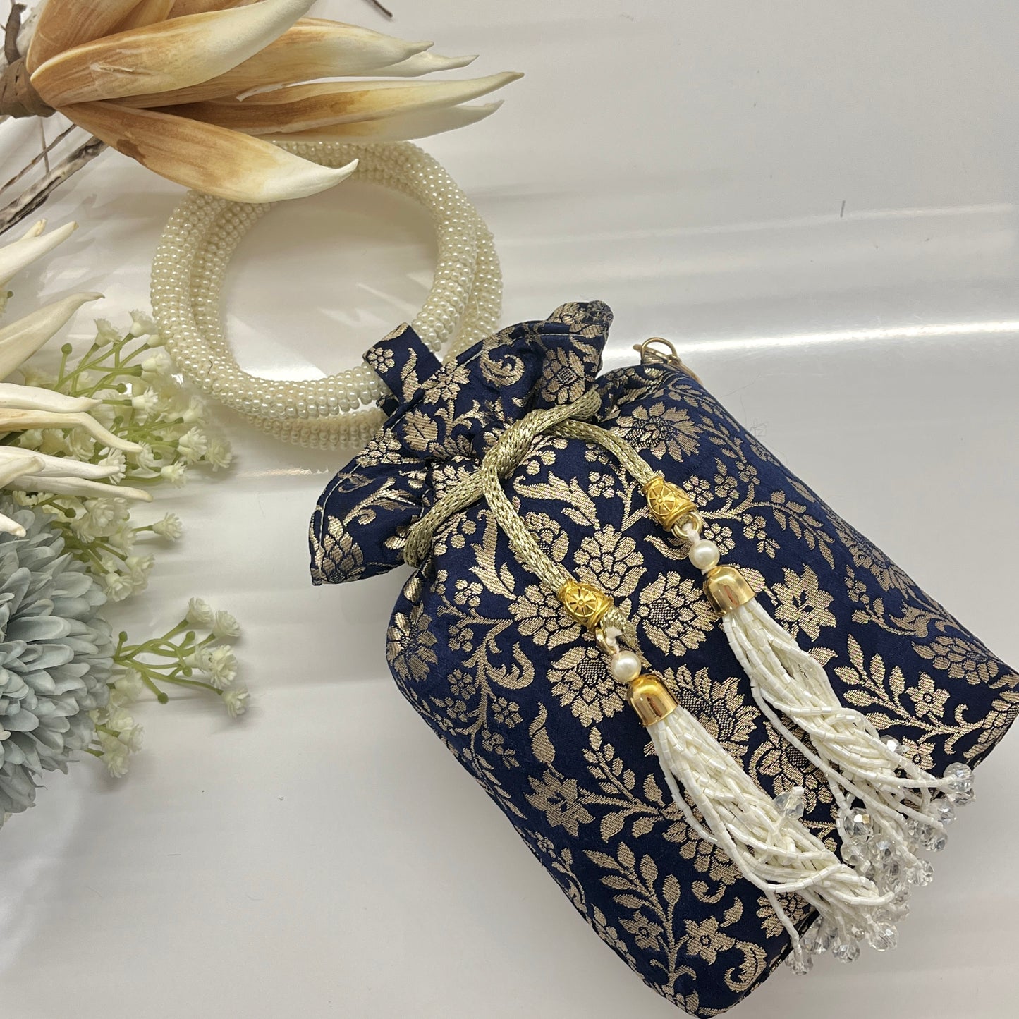 Blue Silk Banarsi Potli With Golden Floral Print