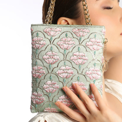 floral patterned handbag with a gold chain strap