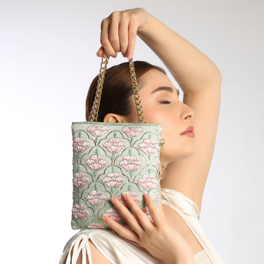 floral patterned handbag with a gold chain strap