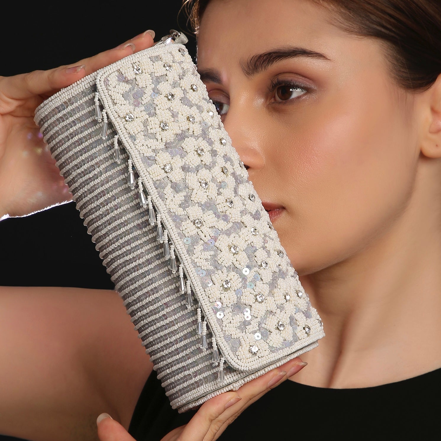 clutch with floral patterns and beads.