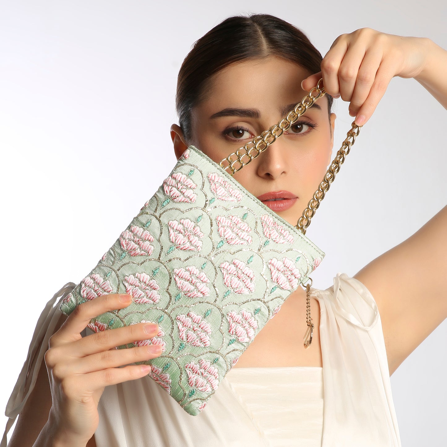 floral clutch with a gold chain strap