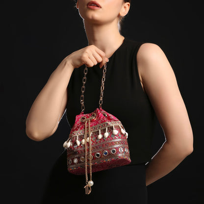 Rani Pink Bandhani Bucket Bag With Mirror Work And Natural Cowrie Shells