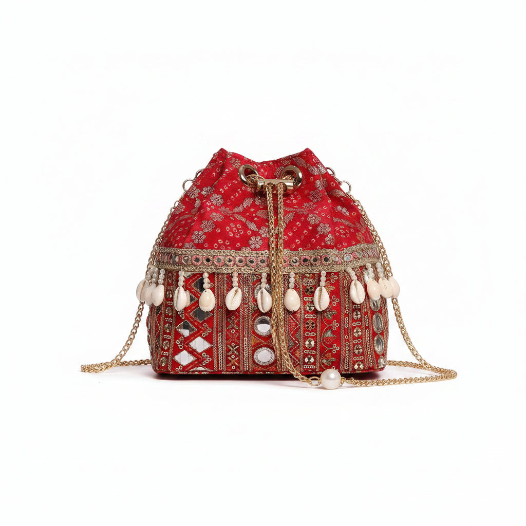 Rani Red Bandhani Bucket Bag with natural cowrie shells and mirror work zari lace