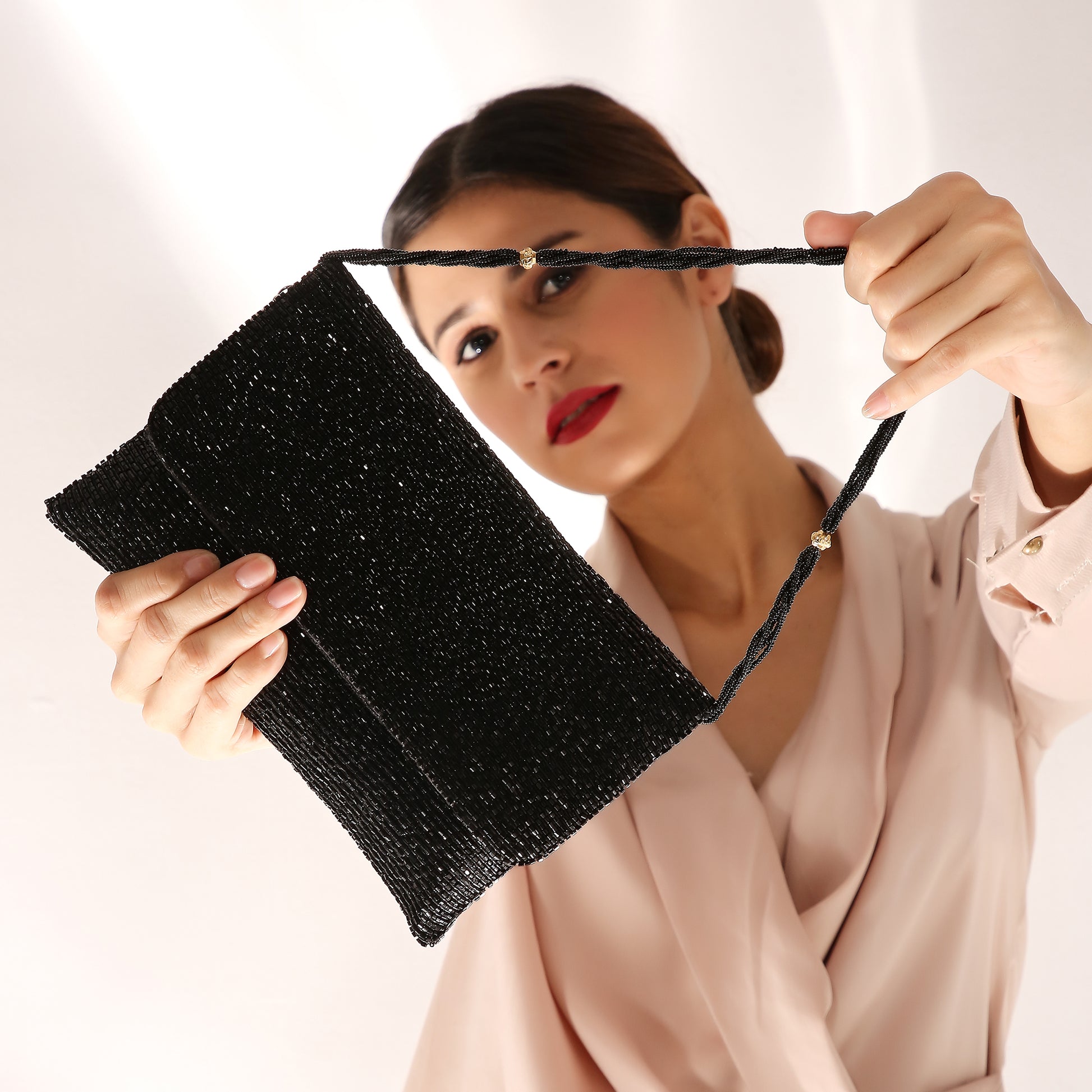 womens black designer clutch bag