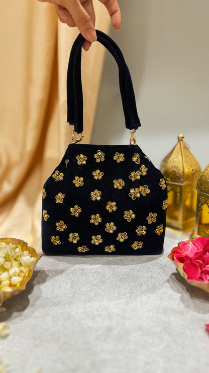 Navy blue embroidered handbag with floral design i in golden zardozi work