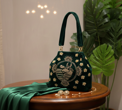 Green embroidered handbag with nandi pichwai in golden zardozi work