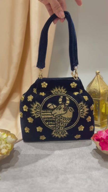 Navy blue embroidered handbag with nandi pichwai in golden zardozi work